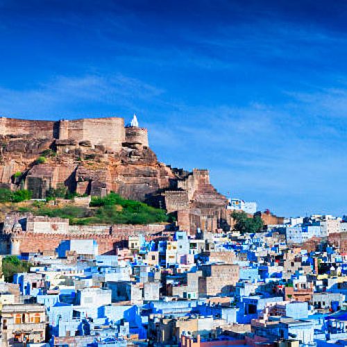High angle cityscape of the Blue City and Mehrangarh Fort, Jodhpur, India.