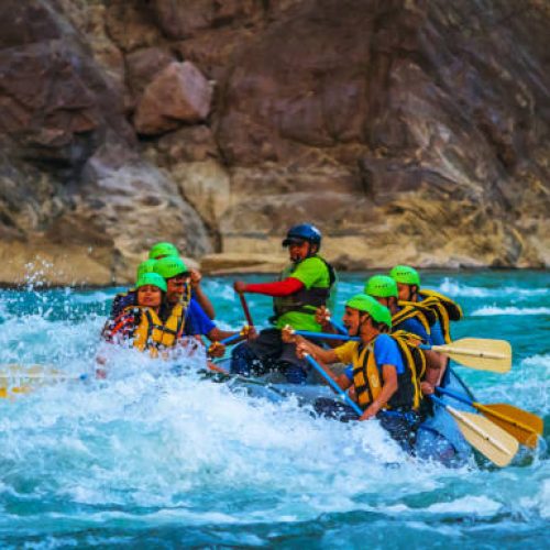 Rishikesh,  India - October 28, 218: young People on  adventure white water river rafting  are enjoying water sports in river Ganges